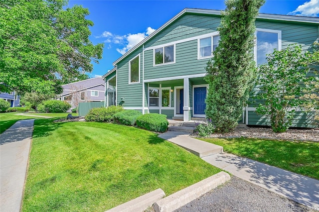 1229 James Cir Unit 1, Lafayette, CO 80026 - view of front facade with a front lawn and covered porch