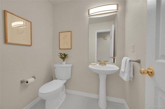 1229 James Cir Unit 1, Lafayette, CO 80026 - bathroom featuring toilet and baseboards