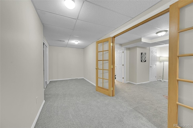 1229 James Cir Unit 1, Lafayette, CO 80026 - finished below grade area with a paneled ceiling, carpet floors, and french doors