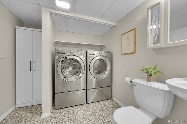 1229 James Cir Unit 1, Lafayette, CO 80026 - bathroom featuring washer and clothes dryer and tile patterned floors