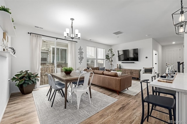 13860 Ash Cir, Thornton, CO 80602 - dining space with visible vents, light wood-type flooring, baseboards, a chandelier, and recessed lighting