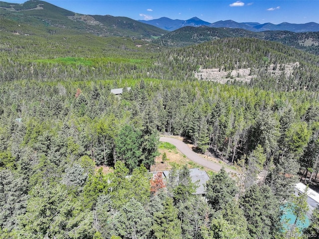 8340 London Ln, Conifer, CO 80433 - aerial view of a heavily wooded area and mountains