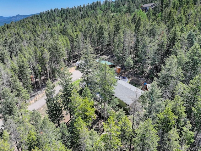 8340 London Ln, Conifer, CO 80433 - view from above of property featuring a forest and a mountainous background