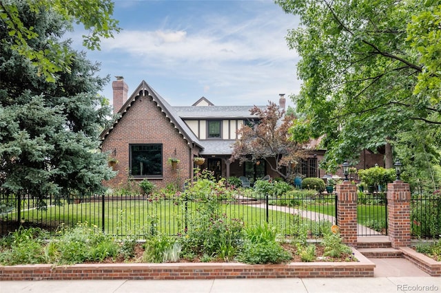 tudor home with a front yard