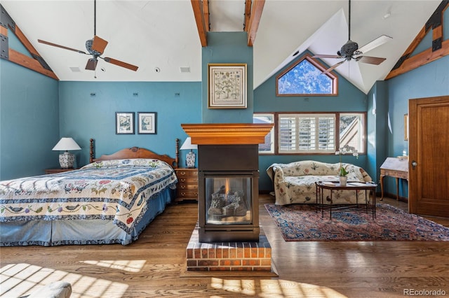 bedroom with beam ceiling, wood-type flooring, high vaulted ceiling, and ceiling fan