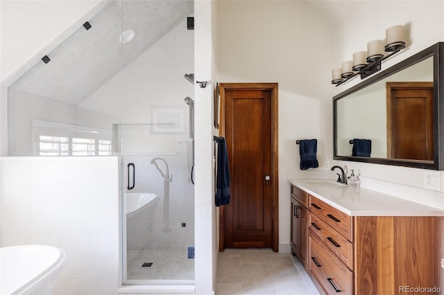 bathroom with vanity, vaulted ceiling, tile patterned floors, and a shower with shower door