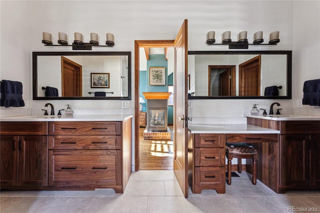 bathroom with tile patterned floors and vanity