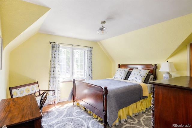 bedroom with vaulted ceiling