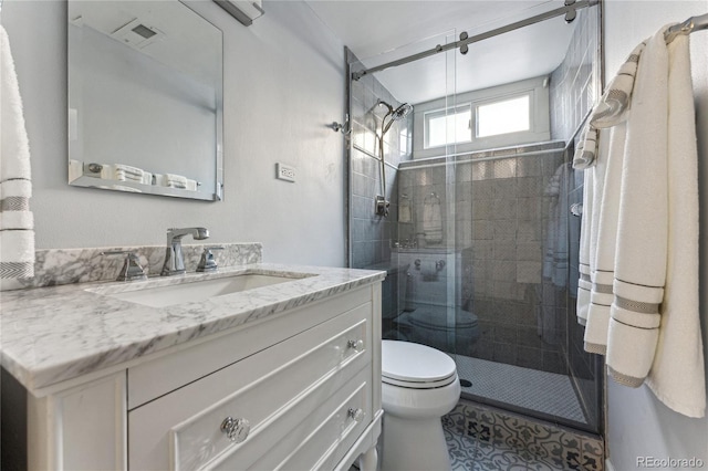 bathroom with vanity, an enclosed shower, tile patterned floors, and toilet