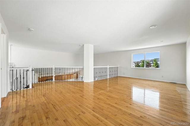 22501 E Belleview Pl, Aurora, CO 80015 - spare room with wood-type flooring and a smoke detector