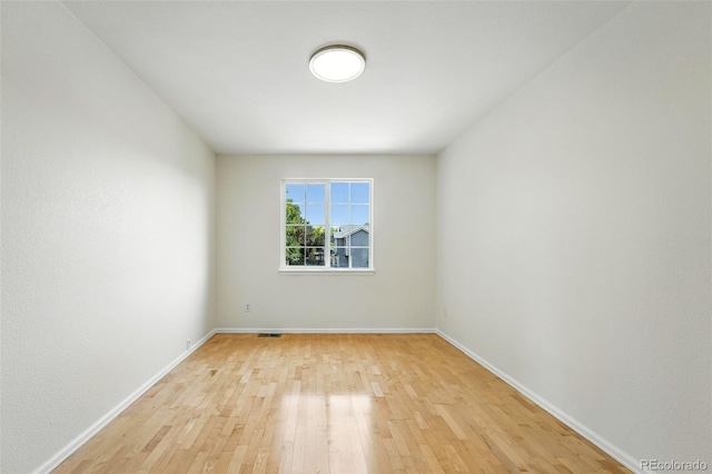 22501 E Belleview Pl, Aurora, CO 80015 - spare room featuring light wood-style flooring and baseboards