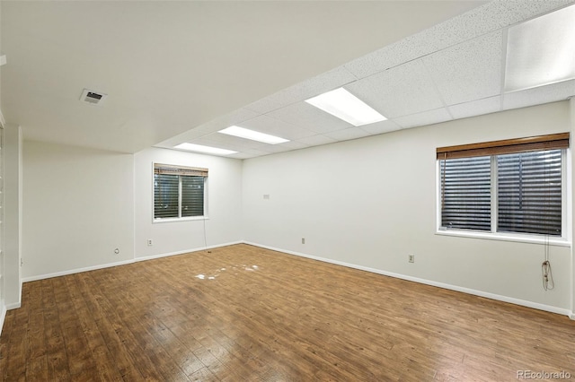 22501 E Belleview Pl, Aurora, CO 80015 - spare room featuring hardwood / wood-style flooring and a drop ceiling