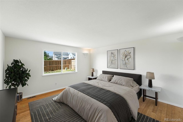 22501 E Belleview Pl, Aurora, CO 80015 - bedroom with wood finished floors and baseboards