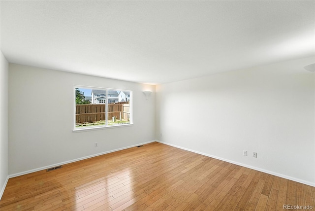 22501 E Belleview Pl, Aurora, CO 80015 - spare room with wood finished floors