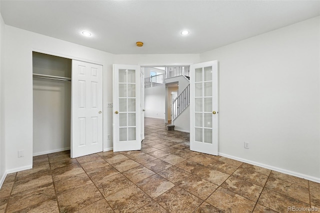 22501 E Belleview Pl, Aurora, CO 80015 - unfurnished bedroom with french doors, a closet, and recessed lighting