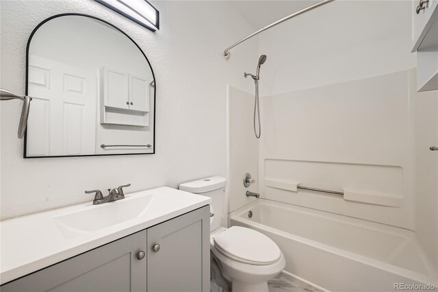 full bathroom with vanity, toilet, and  shower combination