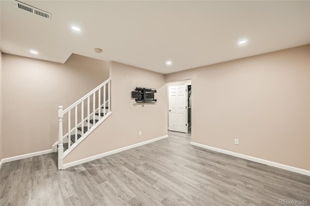 unfurnished living room with wood-type flooring