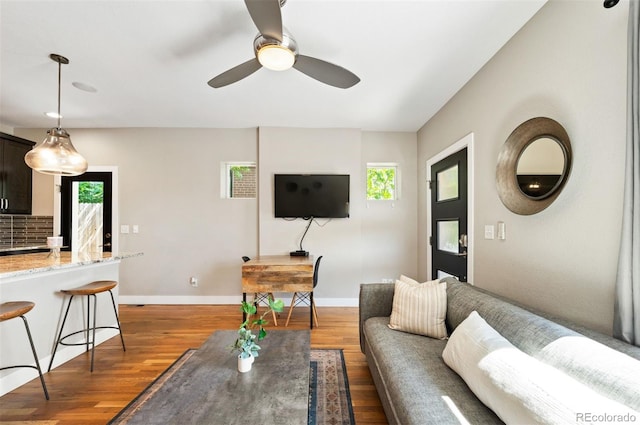 2645 W 24th Ave, Denver, CO 80211 - living area featuring healthy amount of natural light, ceiling fan, and dark wood-type flooring