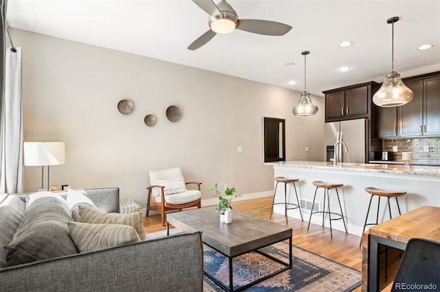 2645 W 24th Ave, Denver, CO 80211 - living room featuring light wood-style floors, ceiling fan, and recessed lighting