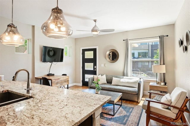 2645 W 24th Ave, Denver, CO 80211 - living area with light wood-style flooring and ceiling fan