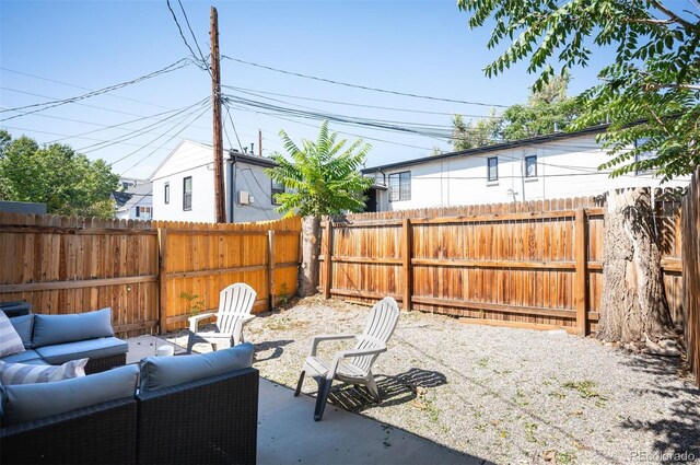 2645 W 24th Ave, Denver, CO 80211 - fenced backyard featuring an outdoor living space and a patio area