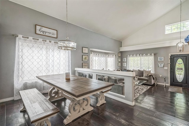 20338 E 48th Dr, Denver, CO 80249 - dining area with a chandelier, high vaulted ceiling, baseboards, healthy amount of natural light, and wood finished floors