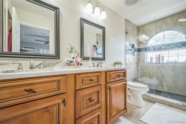 20338 E 48th Dr, Denver, CO 80249 - full bathroom with toilet, double vanity, and tiled shower