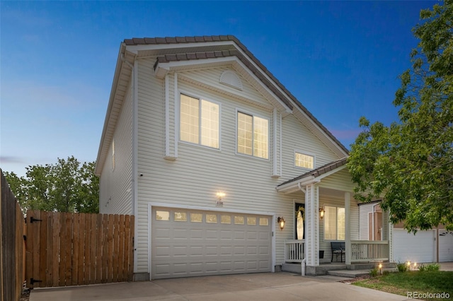 20338 E 48th Dr, Denver, CO 80249 - traditional-style house featuring a porch, concrete driveway, and an attached garage