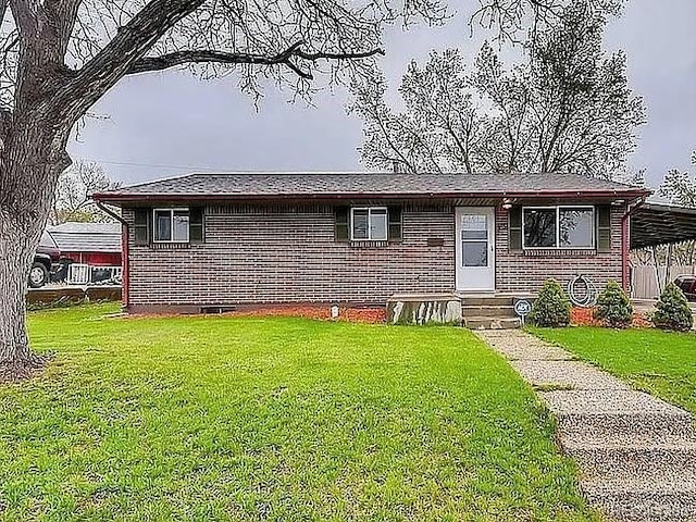 921 Dakin St, Denver, CO 80221 - view of front of house with entry steps, brick siding, and a front yard