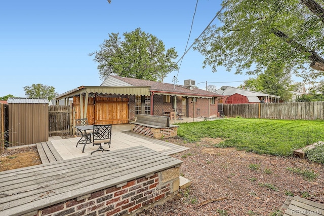 921 Dakin St, Denver, CO 80221 - fenced backyard with a deck and a shed