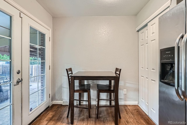 921 Dakin St, Denver, CO 80221 - dining space featuring wood finished floors, a textured wall, and french doors