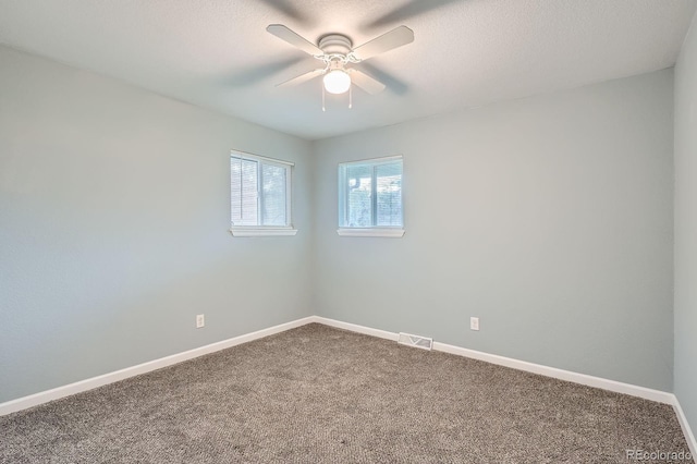 921 Dakin St, Denver, CO 80221 - spare room with ceiling fan, carpet floors, and a textured ceiling