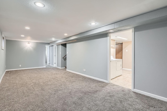 921 Dakin St, Denver, CO 80221 - finished below grade area featuring washing machine and dryer, carpet flooring, and recessed lighting