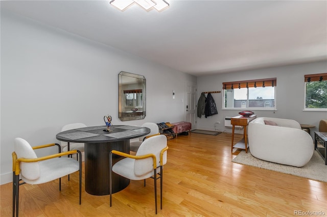 dining space with light wood-type flooring