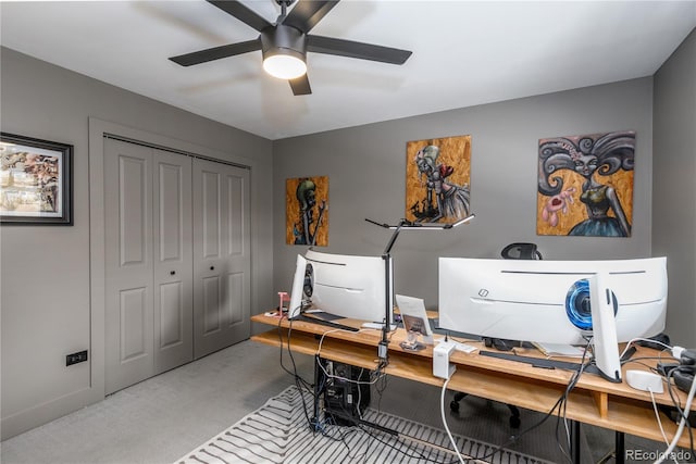 office featuring ceiling fan and light carpet