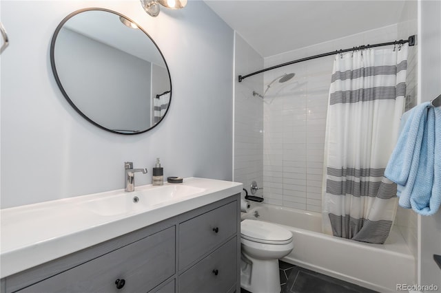 full bathroom featuring tile patterned flooring, shower / bath combo with shower curtain, vanity, and toilet