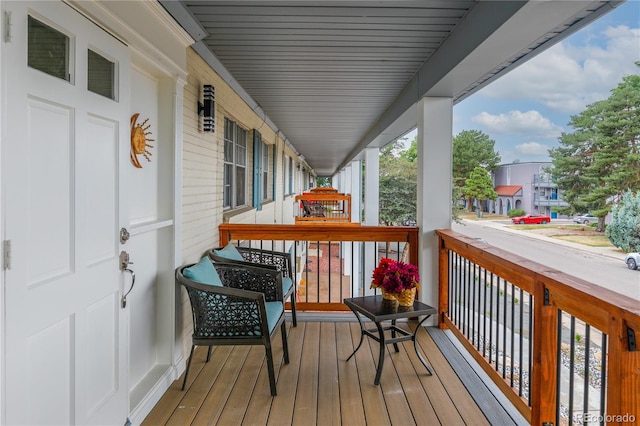 wooden deck featuring covered porch