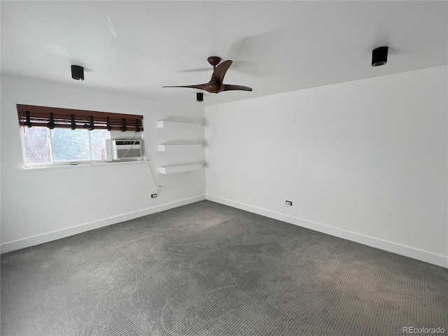 spare room with dark colored carpet, cooling unit, and ceiling fan