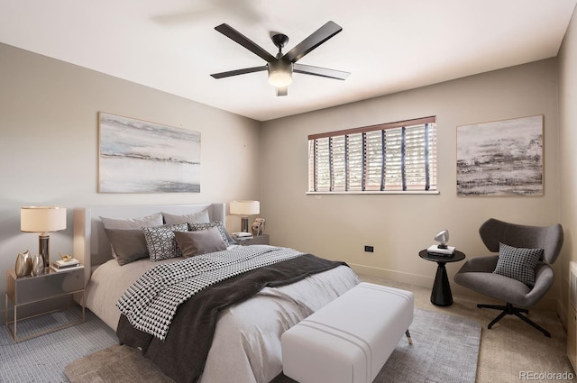 bedroom with light carpet and ceiling fan