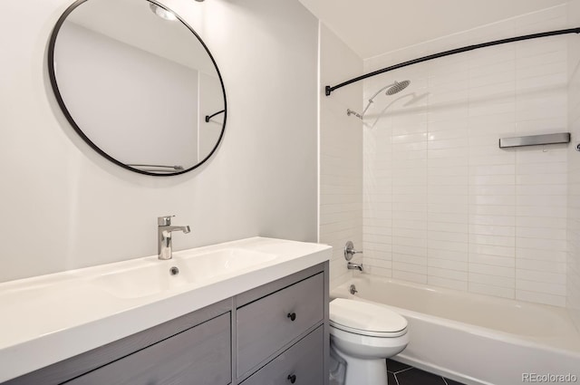 full bathroom featuring vanity, toilet, and tiled shower / bath