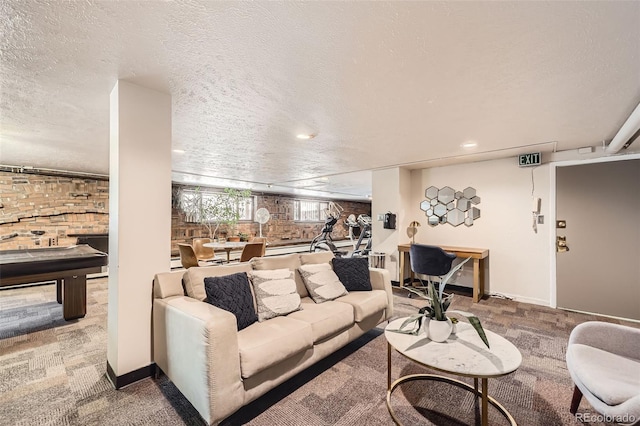 carpeted living room with a textured ceiling