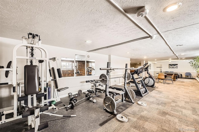 gym with a textured ceiling