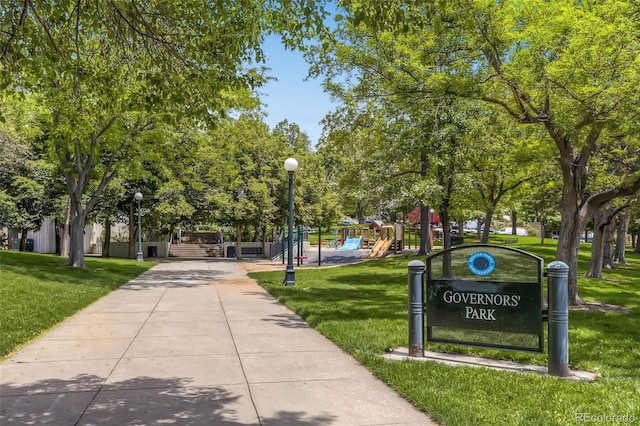 surrounding community featuring a lawn and a playground