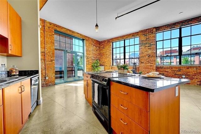 2500 Walnut St Unit 102, Denver, CO 80205 - kitchen featuring black / electric stove, brick wall, dishwashing machine, concrete floors, and a center island