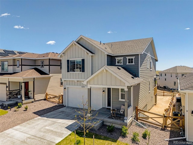 view of front facade featuring a porch, board and batten siding, a garage, and concrete driveway