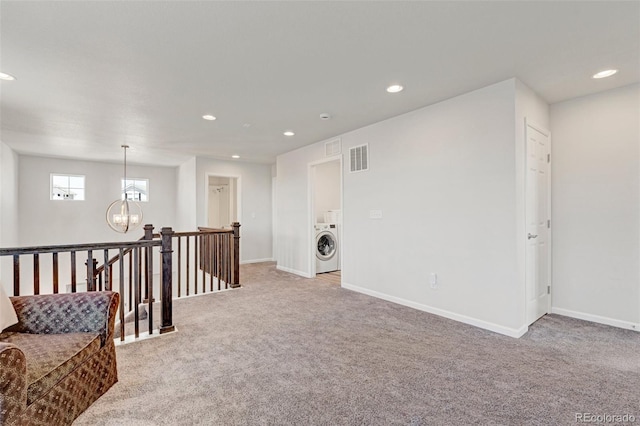 sitting room featuring washer / dryer, light carpet, an upstairs landing, a chandelier, and recessed lighting