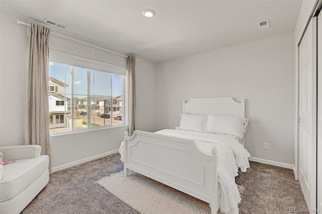 carpeted bedroom with baseboards and recessed lighting