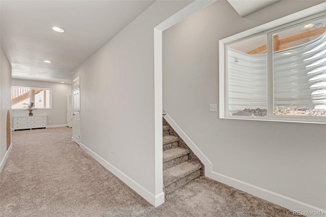 staircase with carpet, baseboards, and recessed lighting