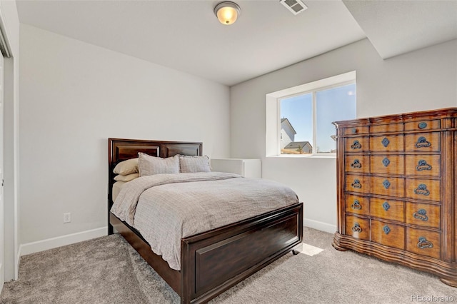 bedroom with carpet floors and baseboards