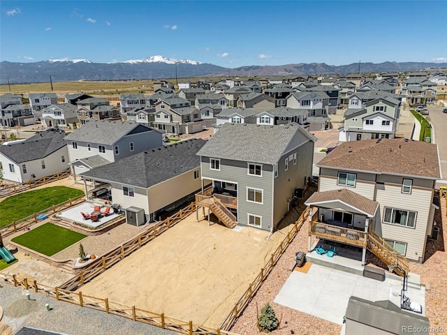 aerial perspective of suburban area featuring a mountainous background